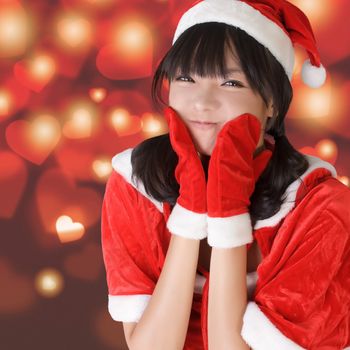 Happy adorable Christmas girl of Asian, closeup portrait.