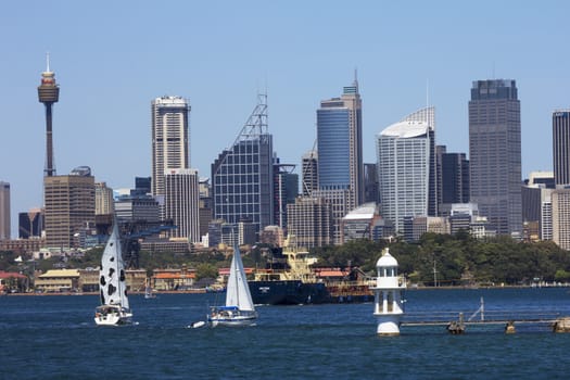 SYDNEY, AUSTRALIA-DECEMBER 19th 2013: The tanker Anatoma makes its way through Sydney Harbour followed by 2 yachts. The waterway is often very busy with large ships, pleasure craft and ferries.