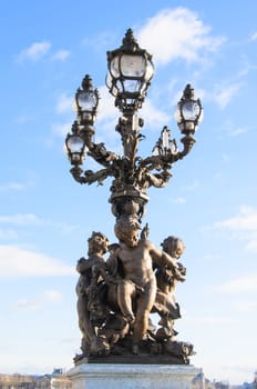 Light pole at the bridge Alexandre III in Paris, France.