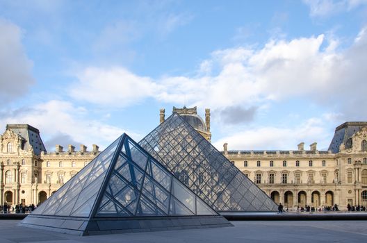 PARIS-DEC 25: Louvre museum is a triangular pyramid for an art exhibit December 25, 2013 in Paris.