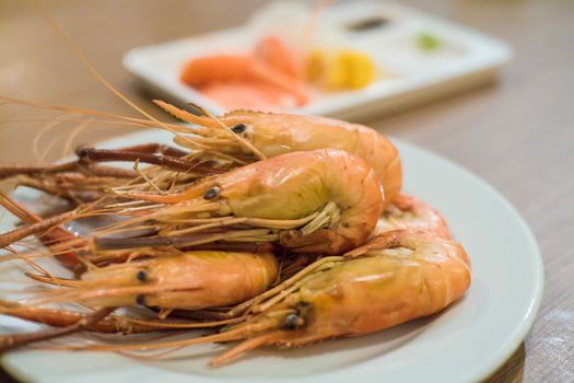 Shrimp grilled with sauce on table