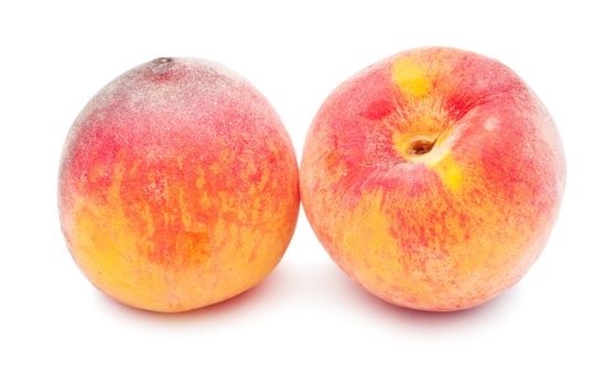 Fresh sweet peaches isolated on white background