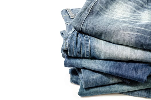 stack of blue jeans over white:Clipping path included.