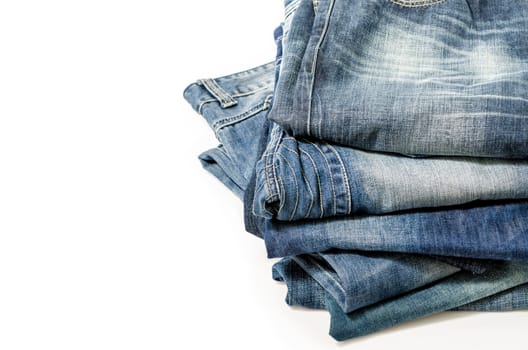 stack of blue jeans over white:Clipping path included.