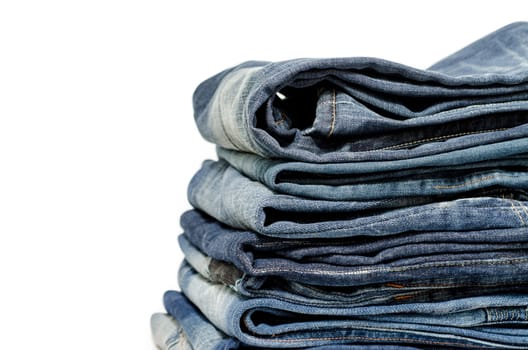 stack of blue jeans over white:Clipping path included.