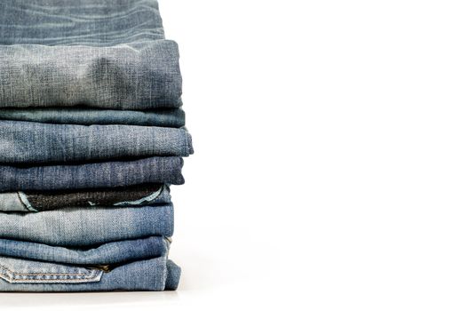 stack of blue jeans over white:Clipping path included.