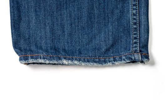 A close up shot of a cuff  denim jeans