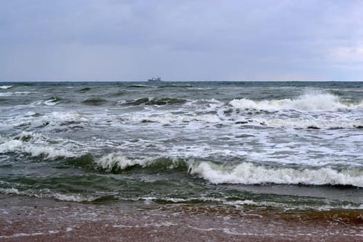 Waves of the Black Sea, Anapa, Krasnodar Krai. The ship in the sea on the horizon