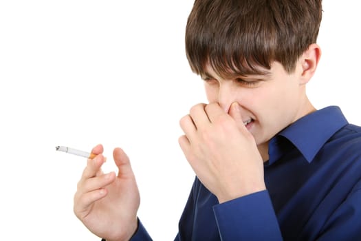 Displeased Young Man with Cigarettes closing the Nose. Isolated on the white background