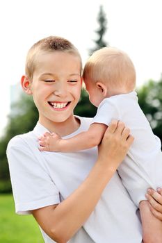 Happy Kid and Little Baby outdoor