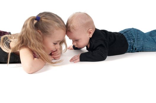 Two children touching to each other's foreheads,  white background