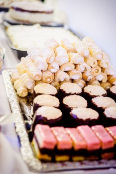 buffet with a variation of sweets on a silver tablet