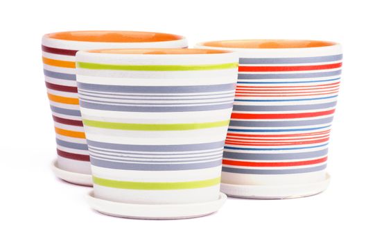 Arrangement of Three Empty Striped Flower Pots isolated on white background