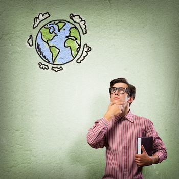 young man with a book thinks. it over symbol planet Earth