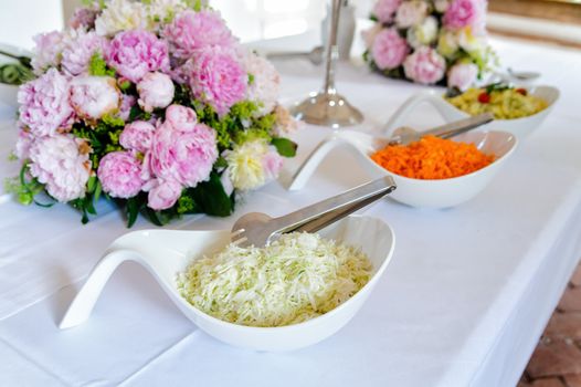 Buffet with different salads on a wedding ceremony