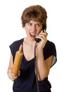 Woman with a rolling pin on the phone screaming isolated on white background