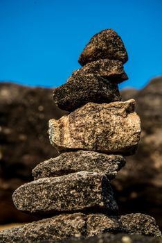 Stone heap and blue sky on the mountain in Thailand.