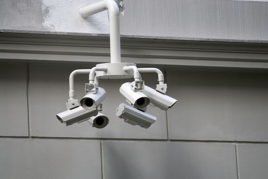 Multiple security surveillance CCTV video cameras monitoring Singapore streets