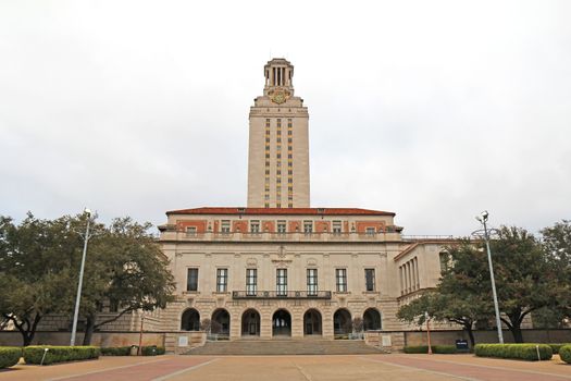Main Building (or The Tower) on the campus of the University of Texas at Austin against a cloudy sky. This clock tower was completed in 1937 and is a main focal point of the campus.