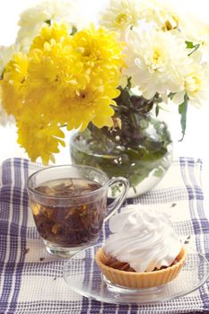 Romantic breakfast. Tea, cake, yellow chrysanthemum