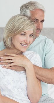 Closeup portrait of a loving mature couple in bed at home