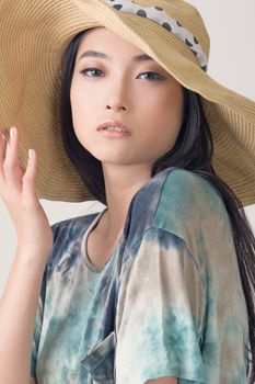 Glamour of Asian beauty with hat, closeup portrait.