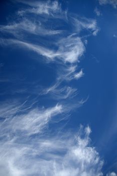 A contrasty blue cloudy sky photographed during the day