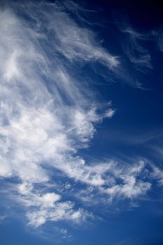 A contrasty blue cloudy sky photographed during the day