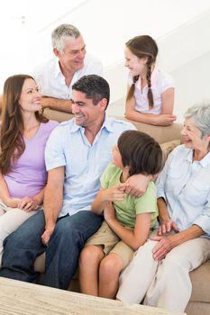 Smiling multigeneration family at home