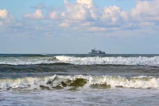 Waves of the Black Sea, Anapa, Krasnodar Krai. The ship in the sea on the horizon