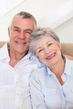 Portrait of affectionate senior couple smiling together at home