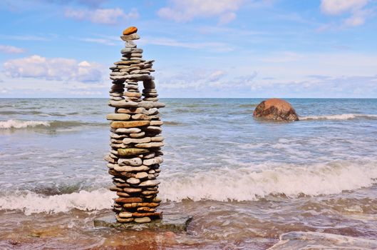 Pyramidal stack of pebbles on the coast