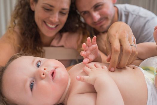 Loving parents looking at baby boy