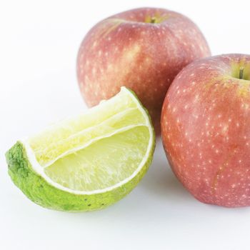 two apple and lime isolated on white background
