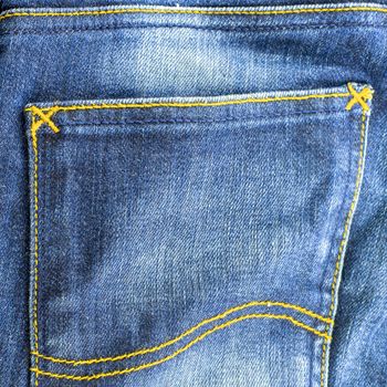 dark jean pocket on blue color background texture