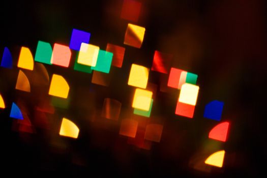 Abstract bokeh background in the form of squares on the night street