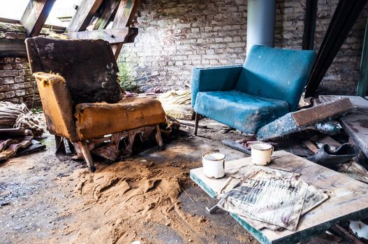 dirty sitting area in an abandoned house