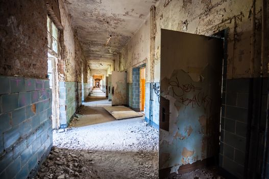 Long corridor in an abandoned dirty building