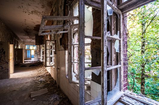 Long corridor in an abandoned dirty building