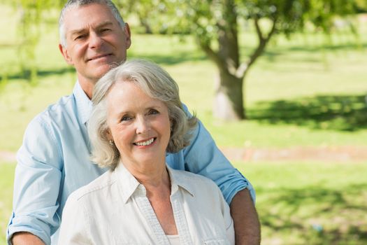 Portrait of a smiling mature couple at a summer park