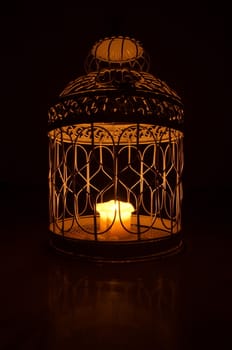 Candle in a cage