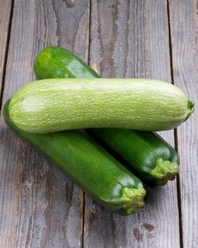 Arrangement of Ripe Zucchini  and Marrow Vegetables isolated on Wooden background