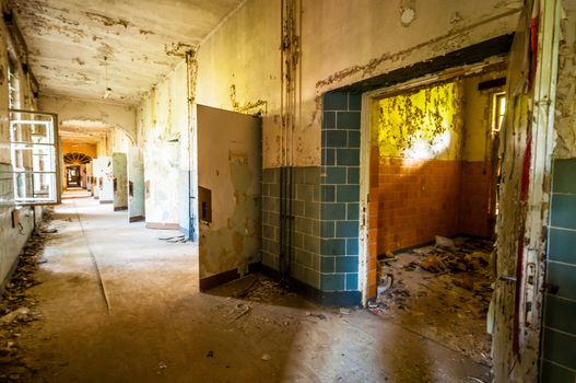 Long corridor in an abandoned dirty building