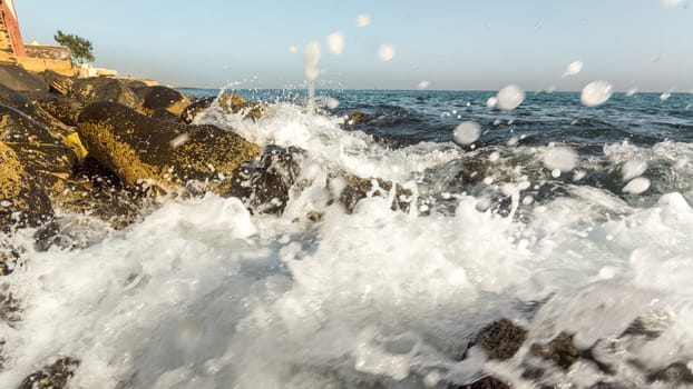 The beautiful waters of the Atlantic ocean with its rocky coastline near the City of Dakar in Senegal