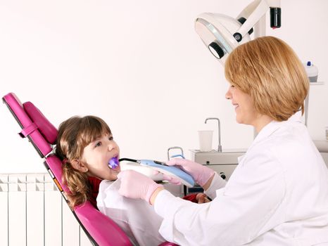 female dentist and little girl healthcare