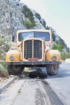 Yellow old truck in the mountain