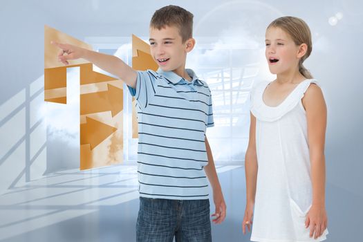 Young boy showing something to his sister against room with holographic cloud