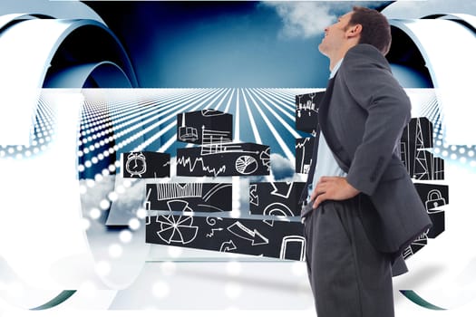 Cheerful businessman standing with hands on hips against abstract design in blue and white
