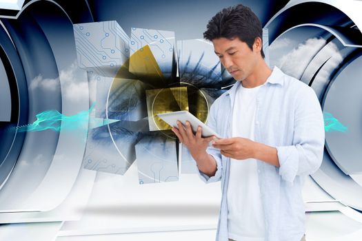 Male looking at his tablet computer against abstract blue cloud design in futuristic structure