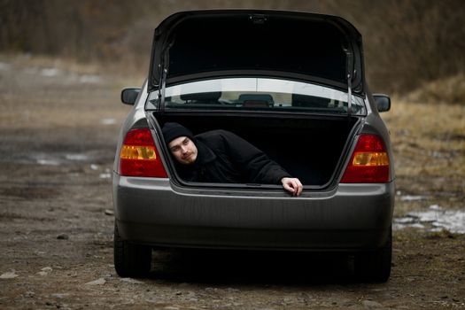 Man in the trunk of a car